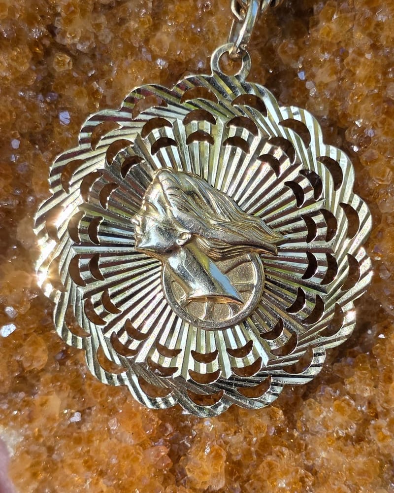 Gold portrait medallion